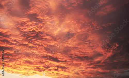 Dramatic cloudy sky at sunset or sunrise. Abstract nature background