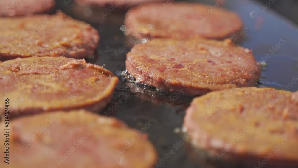 Close up of veggie burgers cooking on grill Close up of veggie burgers cooking on grill