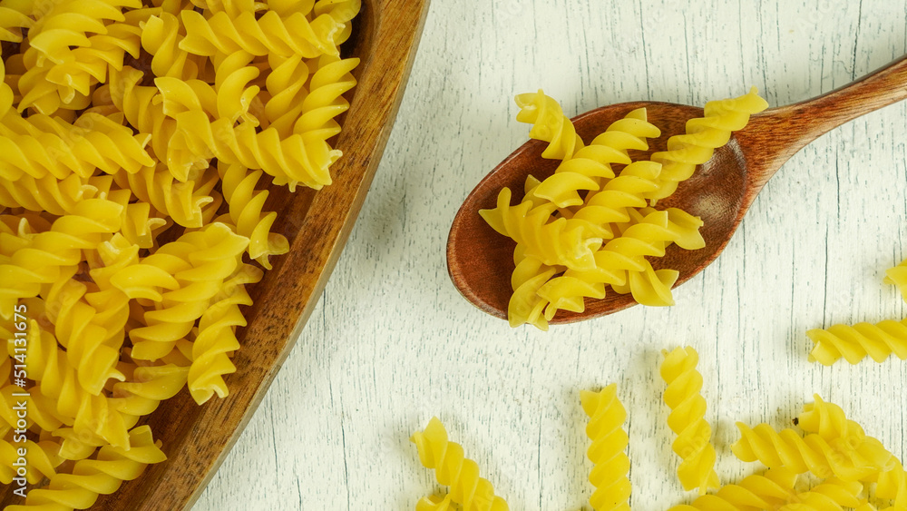 pasta in a dish dry appetizing spiral macaroni in the kitchen food preparation pasta in a dish dry appetizing spiral macaroni in the kitchen food preparation