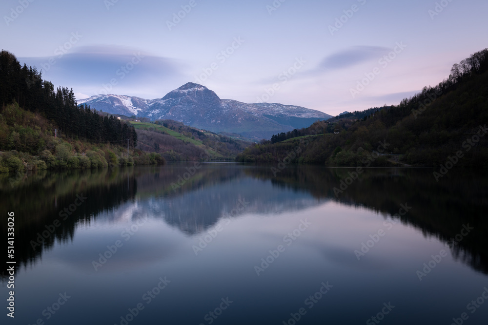 Ibiur reservoir with Txindoki mountain as background, Basque Country in Spain