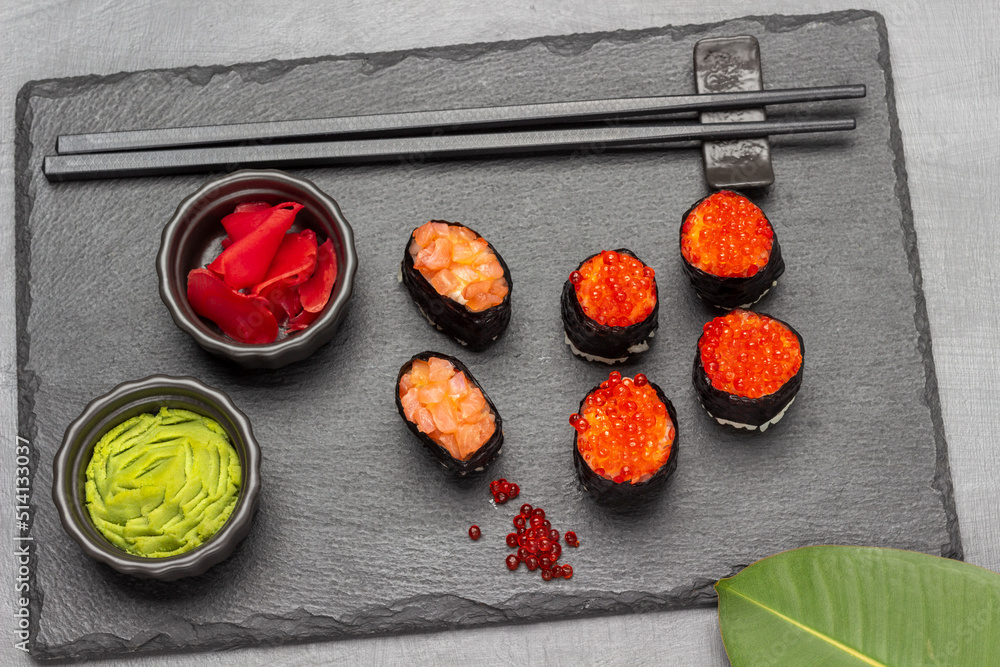 Ginger and wasabi in black bowls. Ginger and wasabi in black bowls.