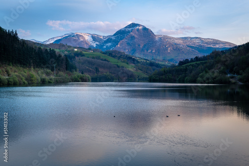 Ibiur reservoir with Txindoki mountain as background  Basque Country in Spain