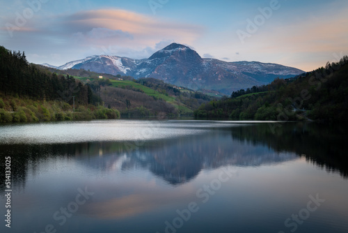 Ibiur reservoir with Txindoki mountain as background, Basque Country in Spain 