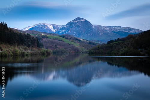 Ibiur reservoir with Txindoki mountain as background, Basque Country in Spain