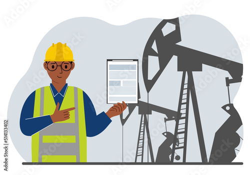 A male refinery engineer worker uses a tableted oil pumping unit. Energy industrial zone, oil drilling.