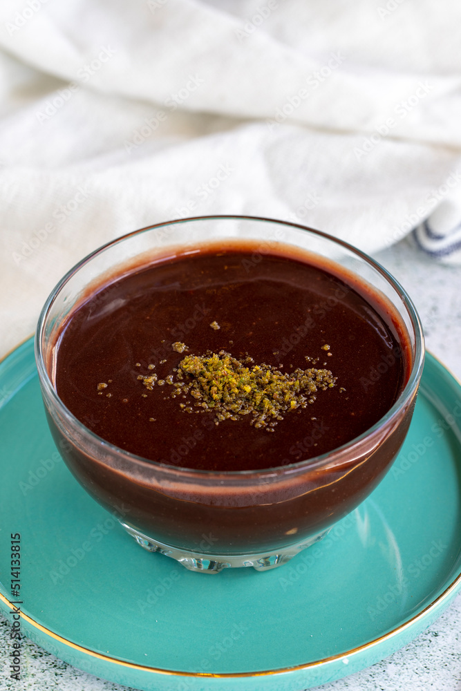 Supangle dessert or sup dessert on stone background. Chocolate pudding with cream filling in the middle. World cuisine delicacies. close up Supangle dessert or sup dessert on stone background. Chocolate pudding with cream filling in the middle. World cuisine delicacies. close up