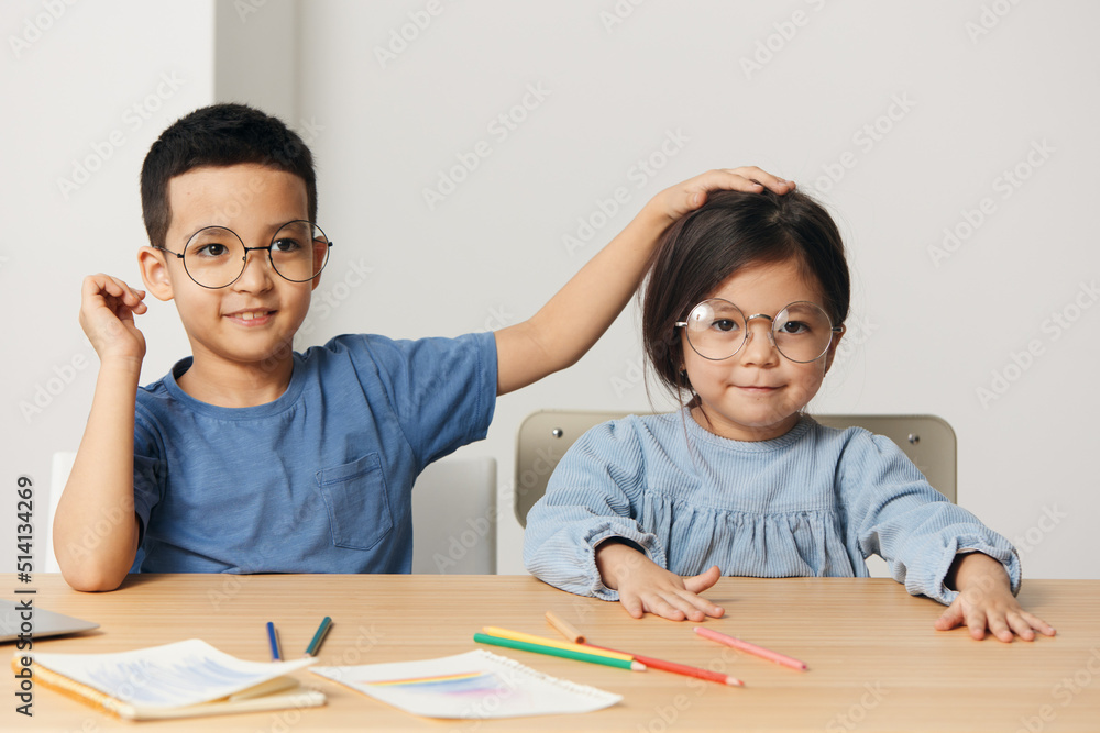 little preschool children sit in class and play around little preschool children sit in class and play around