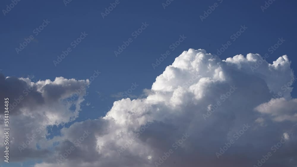 Large cumulus clouds form in abstract shapes in the atmosphere - cloudscape time lapse Large cumulus clouds form in abstract shapes in the atmosphere - cloudscape time lapse