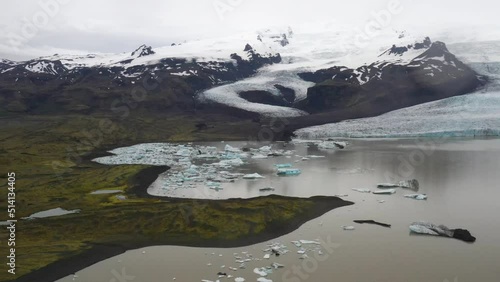 Wallpaper Mural Glacier in Iceland with blue ice in water with drone video moving forward. Torontodigital.ca