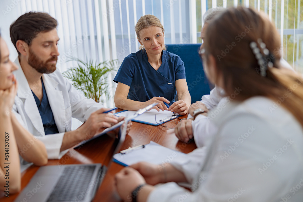 Successful medical doctors are discussing diagnosis during the conference Successful medical doctors are discussing diagnosis during the conference