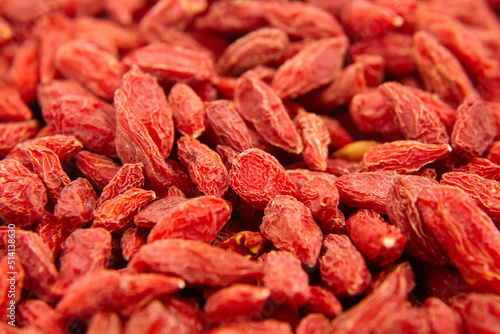 Dried goji berries red background
