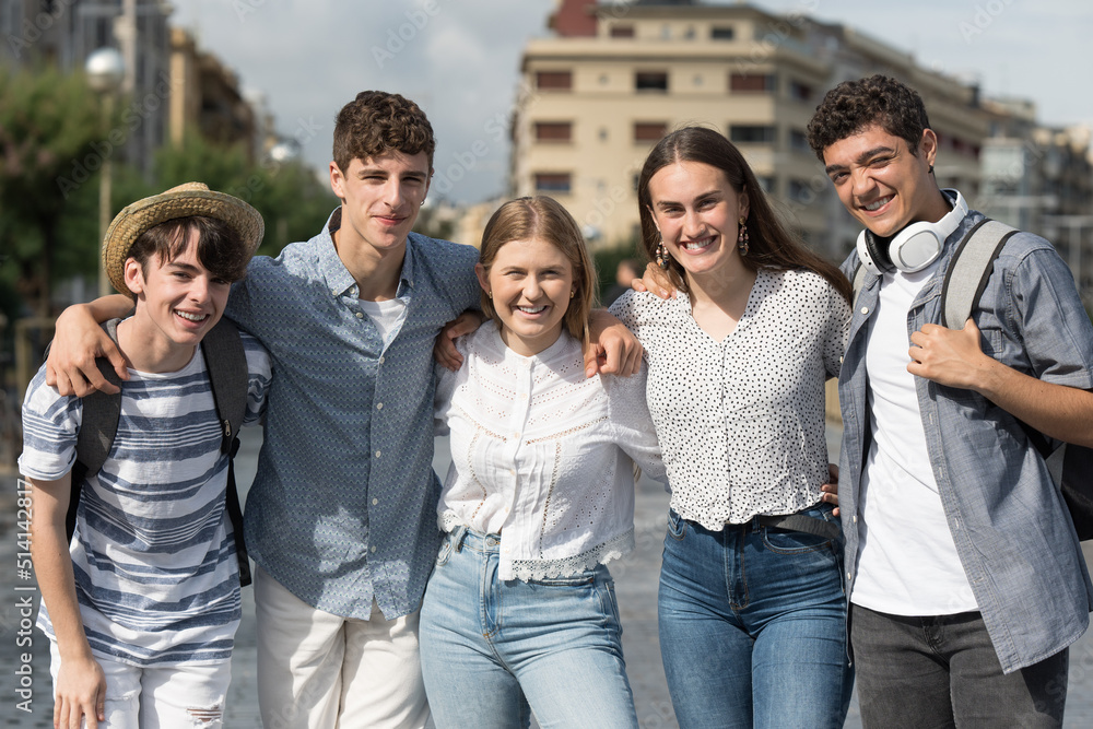 Group of teenagers posing and smiling to camera together. Friendship concept. Group of teenagers posing and smiling to camera together. Friendship concept.