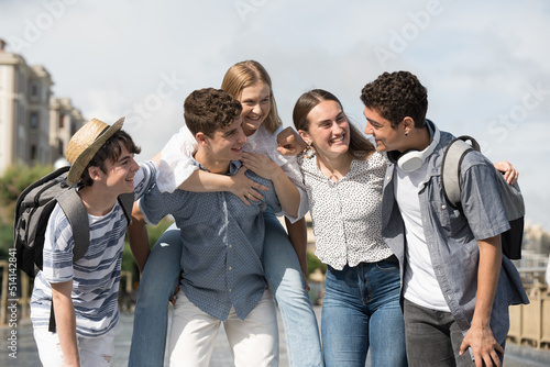 Positive happy group of teenagers having fun together