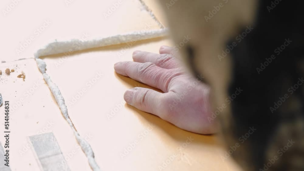 Gluing foam from a gun layers of foam insulation. Laying of underfloor