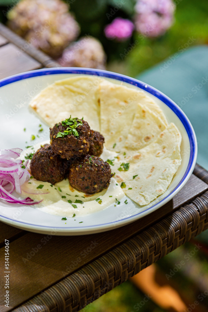 Meat balls with onions, dill, pita bread and white sauce Meat balls with onions, dill, pita bread and white sauce