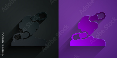 Paper cut Sedative pills icon isolated on black on purple background. Paper art style. Vector