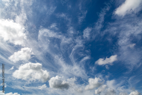 White fluffy clouds and a blue sky