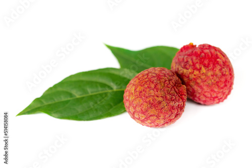 Fresh lychee and peeled showing the red skin 