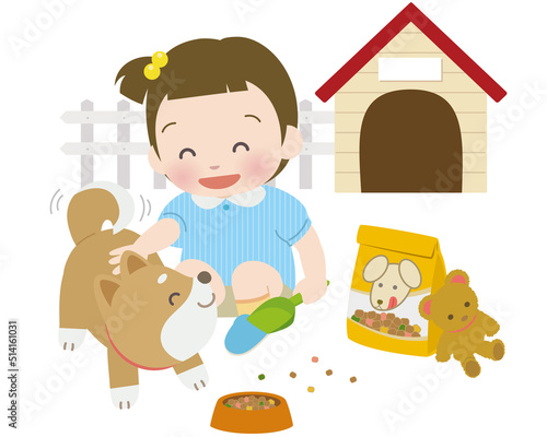 小さな女の子が柴犬に餌やり