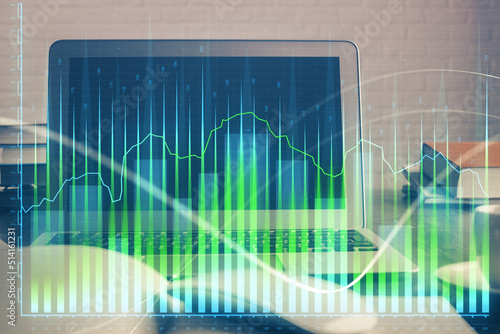 Forex market chart hologram and personal computer background. Double exposure. Concept of investment.