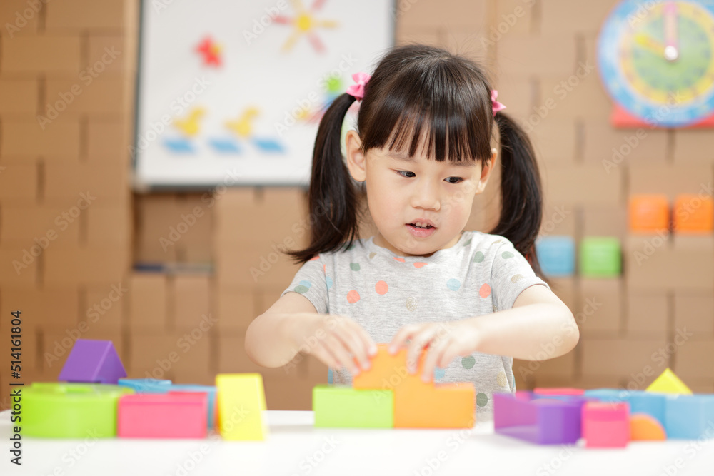 young girl playing creative toy blocks for homeschooling young girl playing creative toy blocks for homeschooling