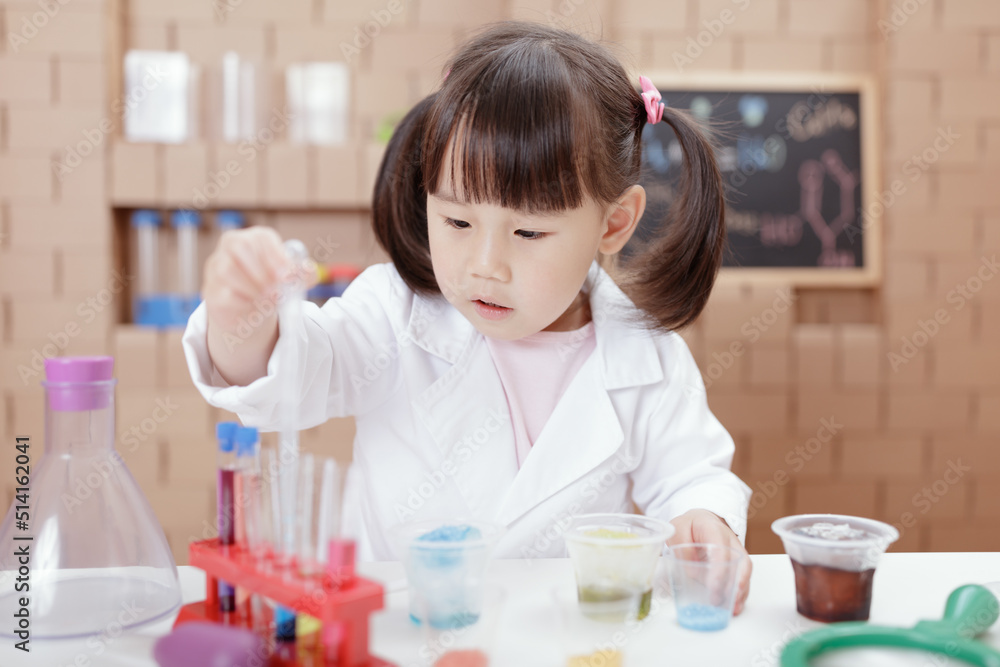 young girl plays science experiment for home schooling young girl plays science experiment for home schooling