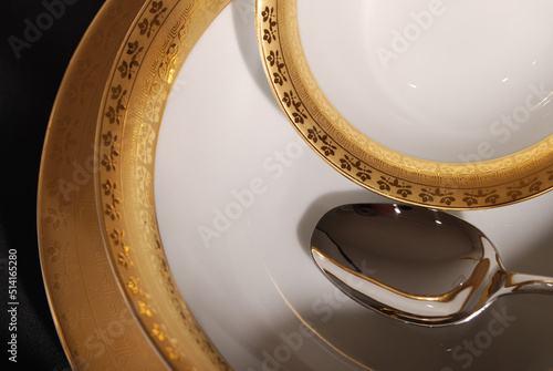 Fotografie Luxury china dinnerware. Elegant golden design porcelain dishes.