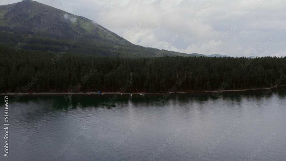 Multin lake and mountains under blue sky in Altai