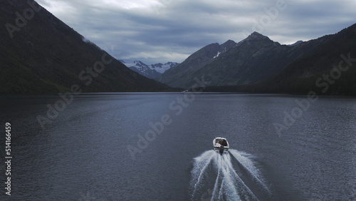 Motorboat on Multin lakes in the middle of mountains in Altai