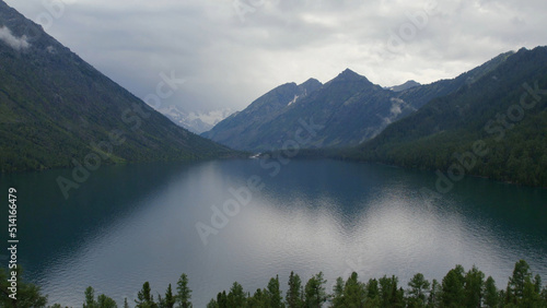 Multin lakes in the middle of mountains under dramatic sky in Altai