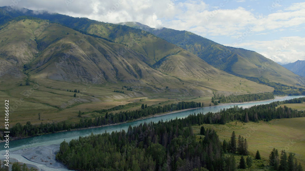 Naklejka premium Blue Katun river in the middle of mountains of Ak-Kem valley in Altai