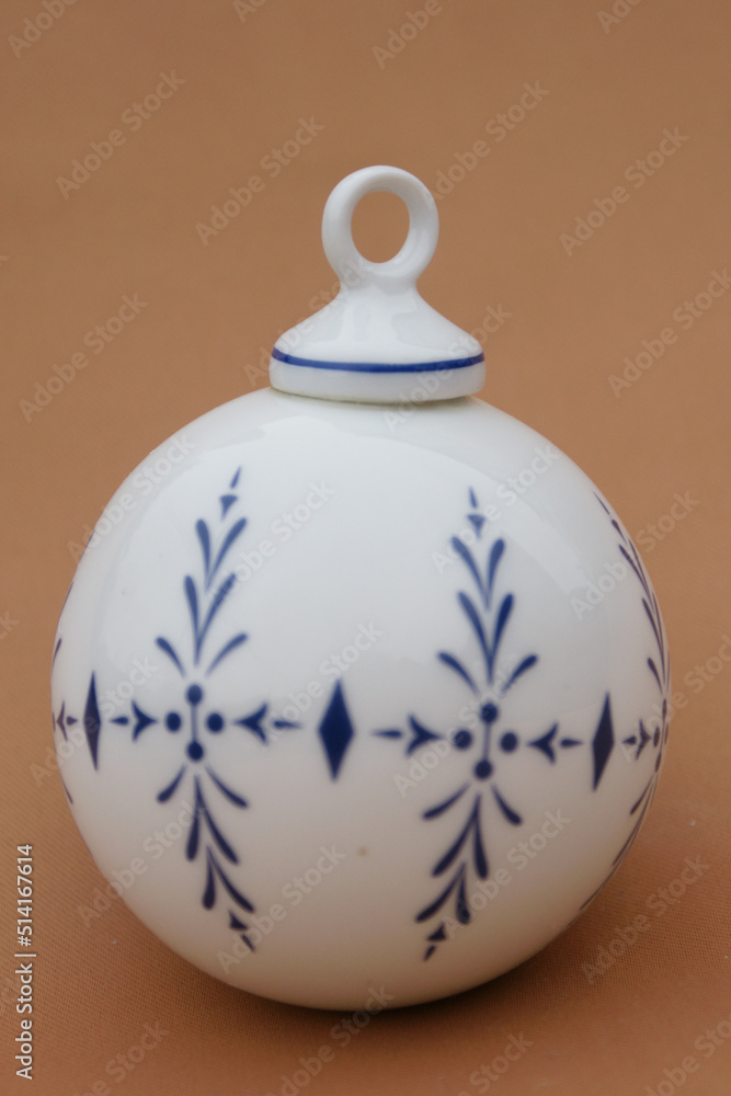 Porcelain globe for decorating the Christmas tree. Winter Holiday and Xmas ornament. Porcelain globe for decorating the Christmas tree. Winter Holiday and Xmas ornament.