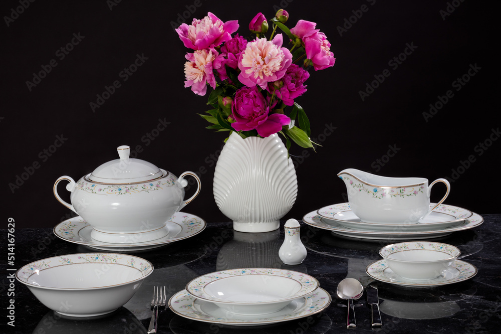 Luxury and elegant porcelain dinner set with a classy golden design. Luxury and elegant porcelain dinner set with a classy golden design.