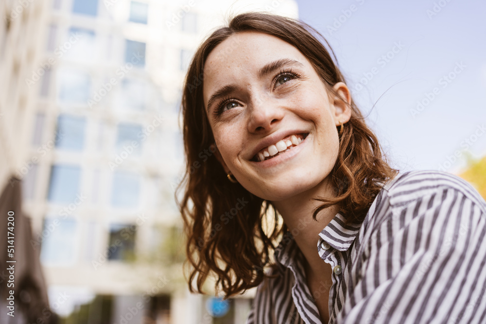 Young business woman standing in office with laptop Young business woman standing in office with laptop