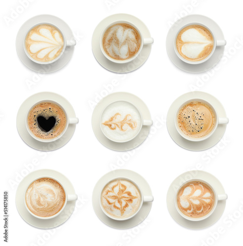 Set with cups of hot aromatic coffee on white background, top view
