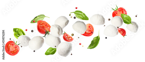 Mozzarella cheese balls, tomatoes, basil leaves and peppercorns for caprese salad flying on white background. Banner design