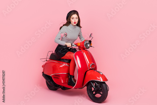 Photo of stylish trendy lady fashionista ride fast motorbike hurry fashion week wear boots isolated pink color background