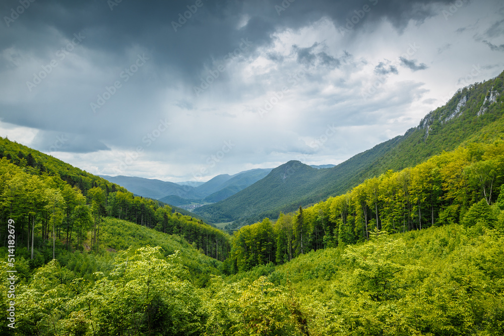 Spring cloudy landscape of hills and forests. The Muranska planina plateau national park in central Slovakia, Europe.