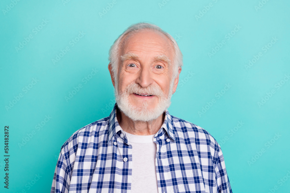 Portrait of handsome good looking kind white haired grandpa wear blue plaid shirt isolated on teal color background Portrait of handsome good looking kind white haired grandpa wear blue plaid shirt isolated on teal color background
