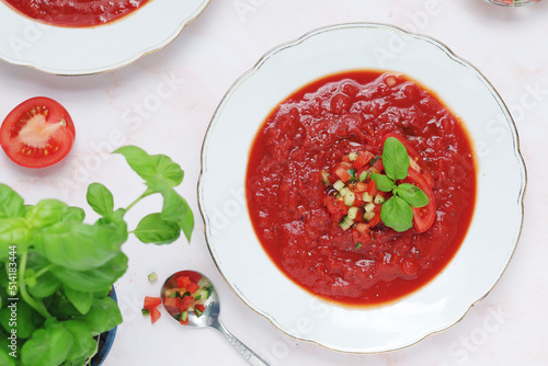 Plates with traditional gazpacho tomato soup