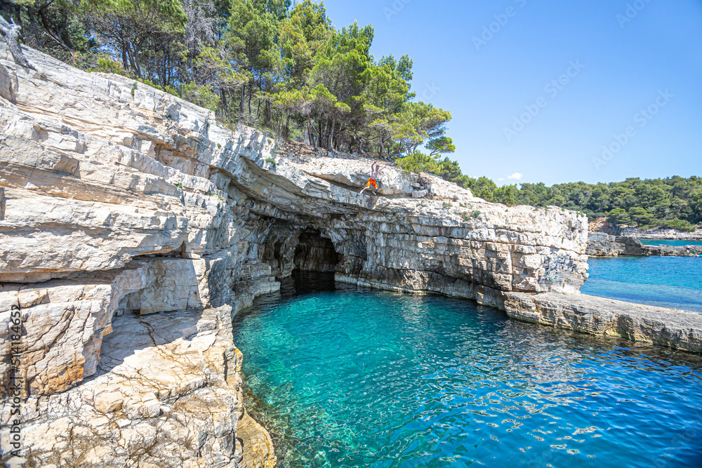 Croatia, Istria, Pula, coastline with rocks and cave