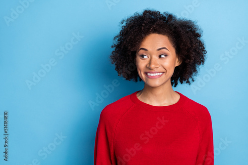 Photo of cute dreamy lady dressed red pullover looking empty space isolated blue color background