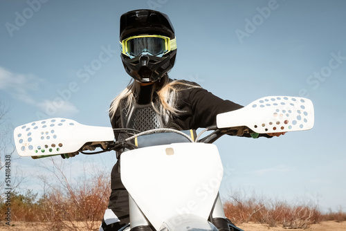 Fototapeta Naklejka Na Ścianę i Meble -  Motocross blondie. Female dirtbike rider.