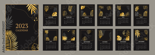 classic monthly calendar for 2023. Calendar with palm and monstera leaves, black and gold color