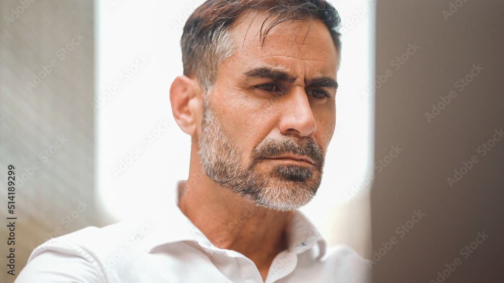 Mature businessman with neat beard wearing white shirt user on laptop pc computer sit at cafe outdoors. Successful man sitting at cafe table outdoors on nature Mobile office freelance Mature businessman with neat beard wearing white shirt user on laptop pc computer sit at cafe outdoors. Successful man sitting at cafe table outdoors on nature Mobile office freelance