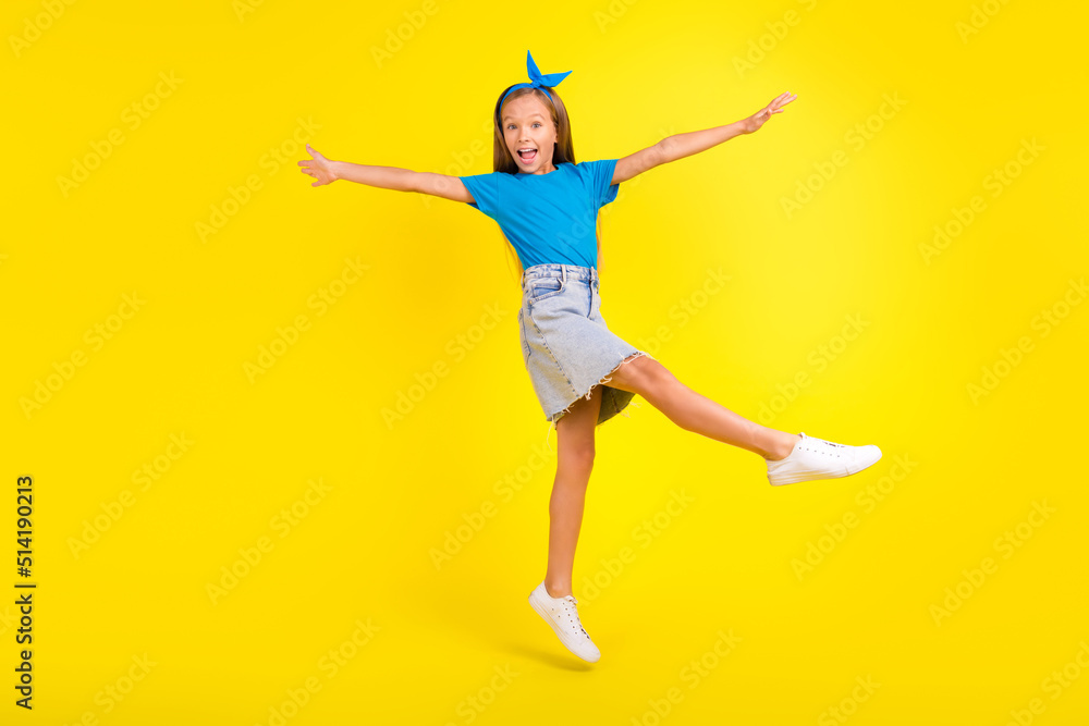 Full body photo of excited overjoyed person jumping have fun good mood isolated on yellow color background