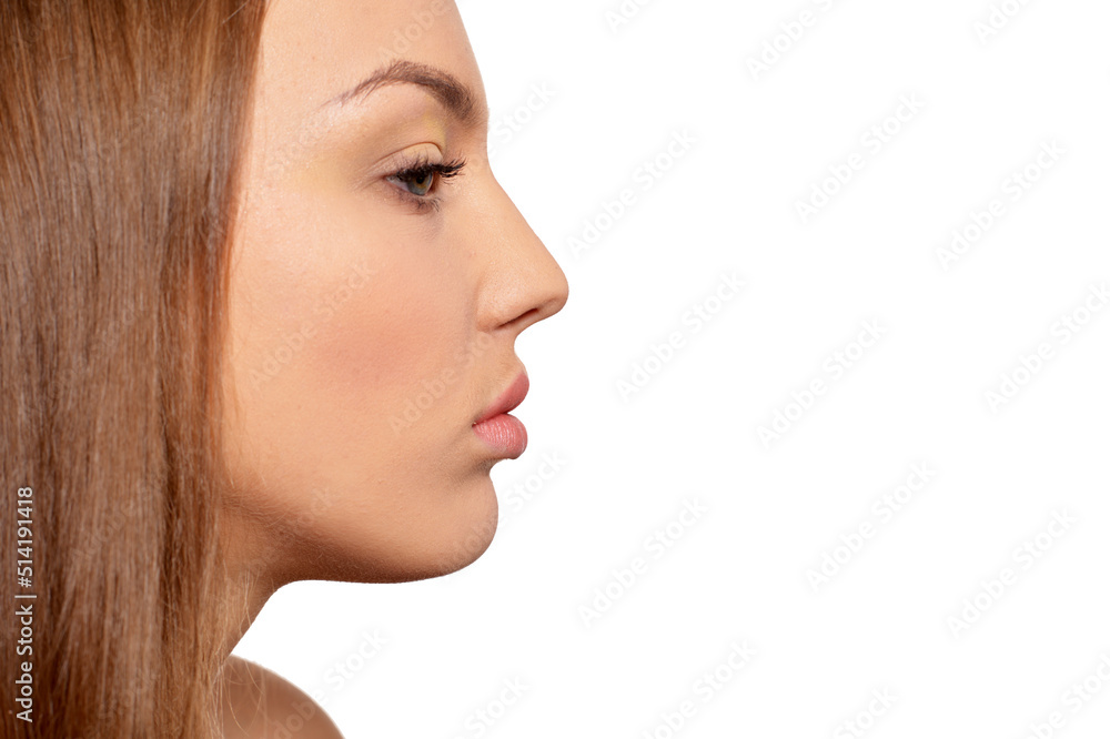 Naklejka premium Side view of beautiful young woman on white background