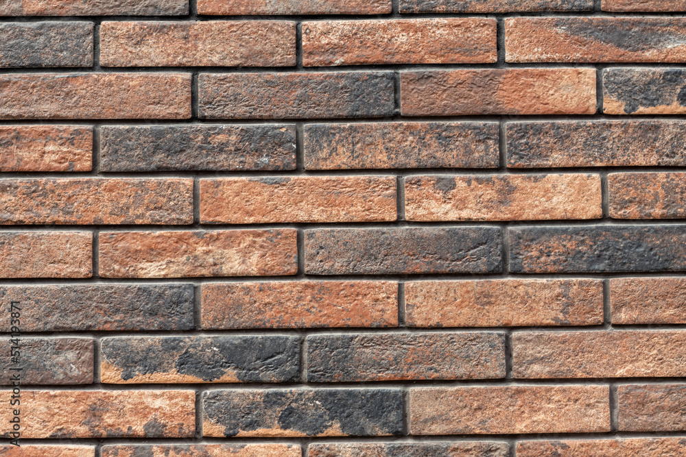 Brick wall background of red and black bricks neatly arranged. Brick wall background of red and black bricks neatly arranged.