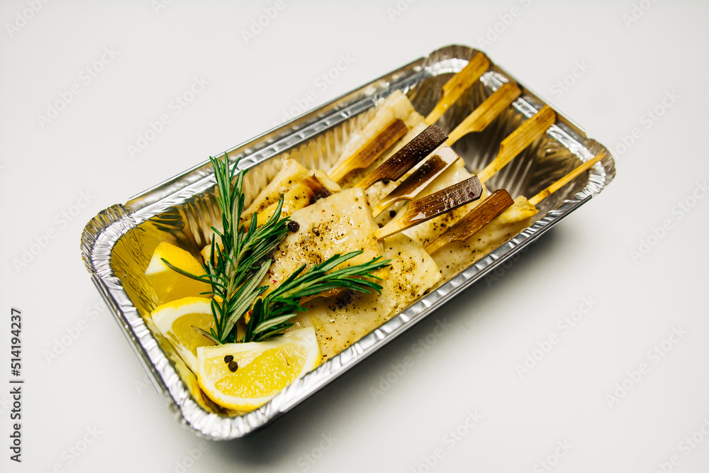 Fried fish in a silver thermal box Fried fish in a silver thermal box