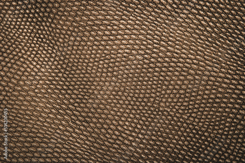 Closeup detail of golden leather texture background.